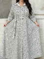 Plus size long-sleeved shirt dress with black floral print on a white background - Floral
