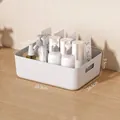 Medium size white plastic storage bin with handles for organizing bathroom cosmetics - Large Storage Basket / White