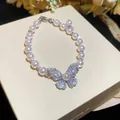 Elegant French style pearl bracelet featuring a sparkling zirconia butterfly pendant - 66# Bracelet Butterfly Pendant Pearl Style / Silver Pink