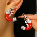 Unique red shrimp stud earrings with sparkling rhinestones for ocean vacation style. - Red Lobster Stud Earrings (0241) / White Gold