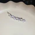 Elegant silver hair pin featuring round white pearls and sparkling clear cubic zirconia stones - Silver