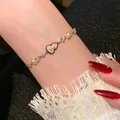 Elegante bracciale dorato con ciondolo a zucca rossa e lussuosi accenti di perle per donna - Bracciale di Palazzo Vintage Zucca Rossa (6#) / Oro-Rosso