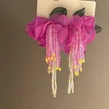 Close-up detail of elegant pink fabric flower earrings featuring long beaded tassels - 1# Silver Needle