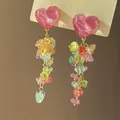 Detailed macro view of colorful stone tassel earrings with pink heart-shaped studs. - 3# Silver Needle