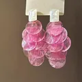 Close-up of pink translucent cascading disk earrings with white rectangular studs. - 4# Silver Needle