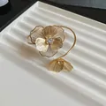 Gold openwork camellia flower bangle with crystal center, elegant floral jewelry for women - Hollow Camellia Bracelet (44#)