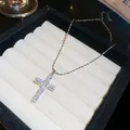 Elegant 18k gold plated zircon cross pendant necklace for women in a jewelry box. - Silver