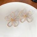 Minimalist gold-tone flower petal wire earrings with elegant and stylish design - Gold