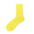 Bright fluorescent yellow ribbed cotton crew socks for men shown in variant view. - One Size / Bright Yellow