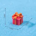 Miniature red resin Christmas gift box ornament featuring a detailed orange bow knot - Pink Gift Box