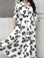 Elegant plus size white maxi shirt dress with black leaf print and a waist belt - Leaf