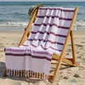 Purple striped 100% cotton Turkish beach towel with elegant tassels draped on a sun lounger - 100*180CM / Purple Fine Stripes