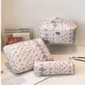 Portable set of three floral quilted cotton makeup bags for travel storage and organization - Number Four
