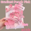 Detailed view of matte gradient pink hair claw clip set featuring flower and butterfly shapes - 8-Piece Set / Gradient Pink