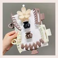 Detail showing a variety of matte hair claw clips in earth tones on a display card - 8-Piece Set / Milk Tea Color