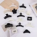 Elegant black and white hair claw clips set in various geometric and flower shapes - 8-Piece Set / Black and White