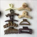 Set of matte and plush hair claw clips in earth tones on white fabric background. - 9-Piece Set / Earth Tone