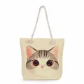 Detailed close-up view of a beige canvas tote bag featuring a cute cartoon cat face print - Beige Cute Cat (msk1221)