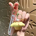 Adorable Pompompurin pudding dog character keychain with a pink silicone wrist strap - Sanrio Snack Family-Pompompurin