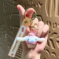 Cute Cinnamoroll character cupcake keychain pendant with soft rubber wrist strap - Sanrio Snack Family-Cinnamoroll