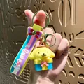 Cute yellow Pompompurin character keychain with colorful I love you silicone strap - Sanrio Pompompurin Gift Box