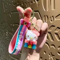 Cute Hello Kitty cartoon keychain featuring a pink bow and blue gift box charm pendant - Sanrio - Hello Kitty (pink) Gift Box