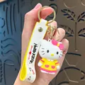 Adorable Hello Kitty character keychain with yellow dress and white wrist strap - Hello Kitty-Yellow Skirt
