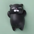 Cute black cat mochi squishy toy for stress relief and relaxation on green background - Small Black Cat