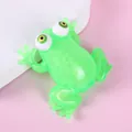 Close-up detail of the green translucent TPR squeeze frog toy with big bulging eyes - Bead Frog - Green / 9.5x7.5x3.7