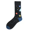 Detailed view of black crew socks featuring colorful outer space planet patterns. - One Size / Outer Space Planet Style