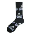 Close-up detail of black crew socks featuring repeating funny shark head and blue wave patterns - One Size / Great White Shark Style