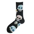 Close-up of black crew socks with vibrant Mexican sugar skull patterns on white backdrop. - One Size / Sugar Skull Style