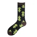 Detailed view of black crew socks with repeated green frog pattern and brown accents - One Size / Frog Style