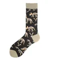 Detailed view of black crew socks with fun dinosaur skeleton pattern and tan accents - One Size / Dinosaur Fossil Style