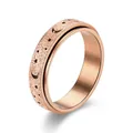 Elegant rose gold spinner ring with hollow moon and stars pattern in matte finish. - Rose Gold