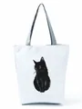 Close-up detail of white canvas tote bag featuring a minimalist black cat illustration print. - Black Cat Realistic Print (hl3547)