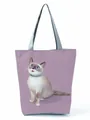 Close-up detail of a purple tote bag featuring a cute Siamese cat illustration print. - Siamese Cat Illustration (hl3556)