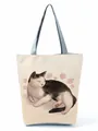 Detailed view of cream canvas tote bag featuring a cute sleeping cat and pink roses - Cat and Rose Print (hl3562)