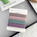 Set of 4 high-elasticity hair ties with soft textured ribbing in assorted pastel colors - Dusty Pink