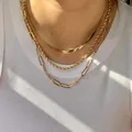 Layered gold necklace featuring flat snake chain, rope chain, and paperclip links. - Three-layer Stacked Snake Chain, Rope Chain and Paperclip Chain (08 Gold) / Gold