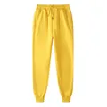 Felgele unisex fleece joggingbroek met een trekkoord, elastische taille en boorden - S / Geel