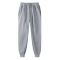 Casual grey fleece jogger sweatpants with adjustable drawstring waist and ribbed cuffs - Gray