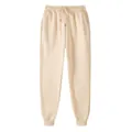 Comfortable beige fleece joggers with elastic drawstring waist and ribbed cuffs. - Khaki