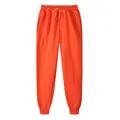 Vibrant orange fleece-lined joggers with elastic drawstring waist and ribbed cuffs - Orange