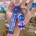 Purple astronaut bear keychain with silicone strap and Explore Future text for bags - Space Hero / Purple