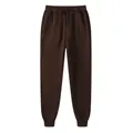 Brown unisex fleece jogger pants with elastic drawstring waist and ribbed cuffed ankles - Coffee