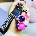 Space bear keychain with starry sky design and black Explore Future wrist strap charm - Roaming Sitting Bear / Pink