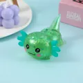 Detailed macro view of a green glitter axolotl squishy toy with shiny sequins for stress relief - Green