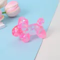 Close-up of a pink iridescent balloon dog squishy toy with glitter sequins inside - Pink