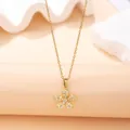 Detailed view of an elegant gold flower pendant necklace with pavé set clear stones. - Five-Petal Flower Style (X-044) / Gold